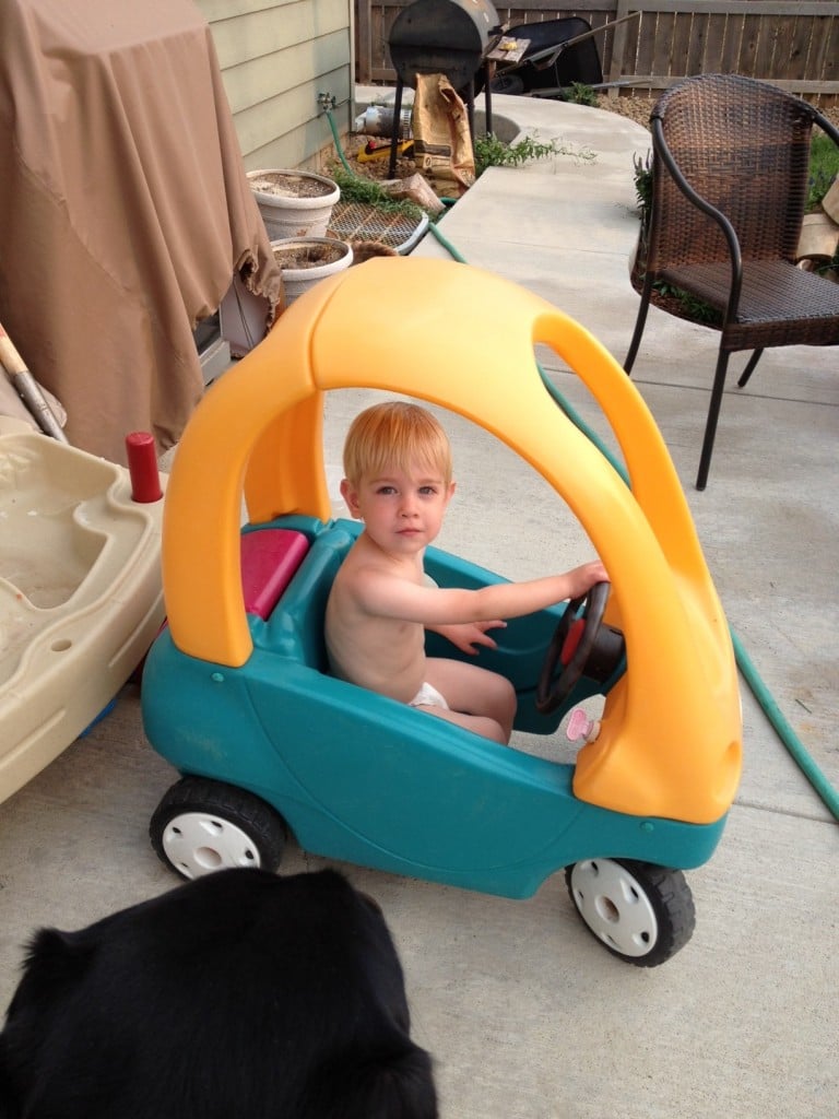 picture of a toddler in a plastic car