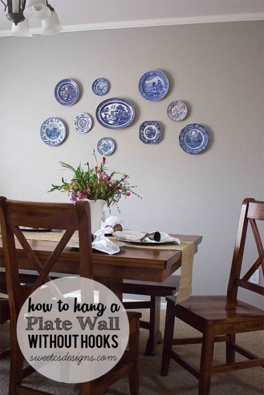 How to hang a plate wall without hooks at sweetcsdesigns.com- this is such an easy tip! No more hooks showing from plates and you can move plates around easily! #homedecor #plates #diy