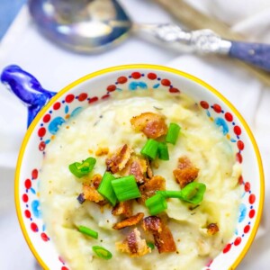 A bowl of mashed potatoes with bacon and green onions, perfect as a Thanksgiving leftover recipe.