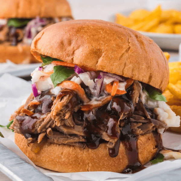 The Best Smoked Pulled Pork Sandwich with Coleslaw and Fries.