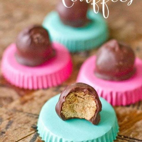 Cookie butter truffles on a wooden table.