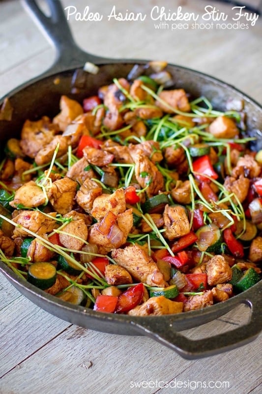 skillet with chicken, bell pepper, zucchini, and sprouts