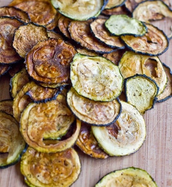 Low-carb zucchini chips on a cutting board.