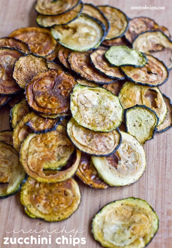 baked zucchini slices with salt and pepper on them. 