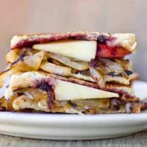 Apple and brie grilled cheese sandwich with onion and jam.