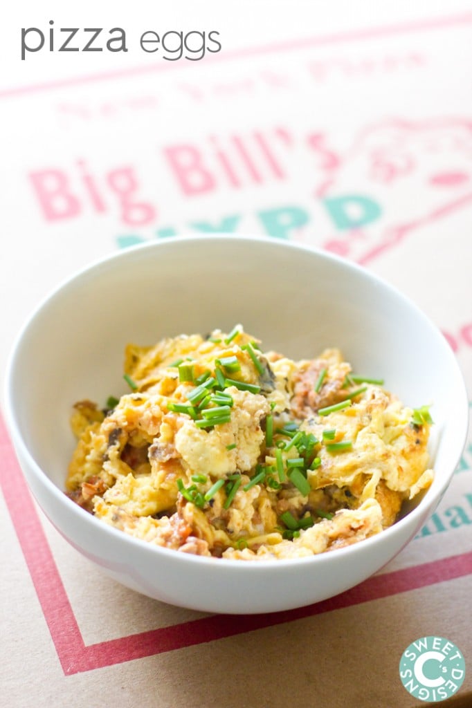 bowl with eggs with bits of leftover pizza in them and chives on top