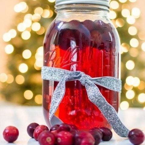 Cranberry-infused moonshine in a mason jar.