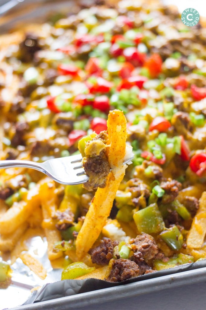 fries on a sheet pan with ground beef, cheese, and black olives