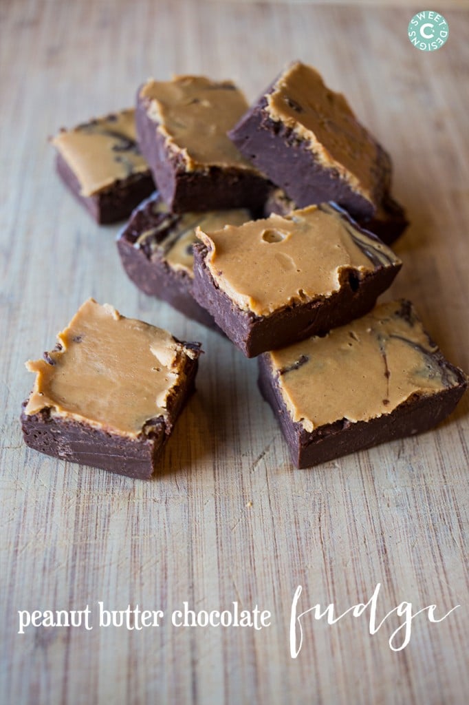 peanut butter chocolate fudge cubes on a wooden cutting board