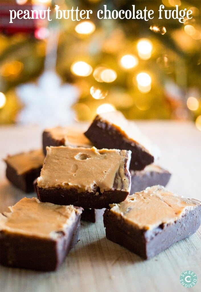 peanut butter chocolate fudge cubes on a wooden cutting board