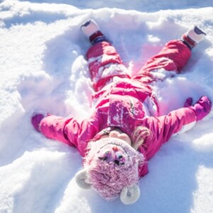 A little girl enjoying the snowy landscapes of Avon and Beaver Creek Colorado.