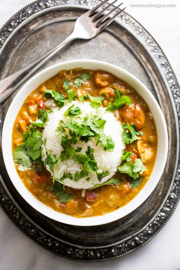 stew with beans and vegetables with rice and cilantro on top