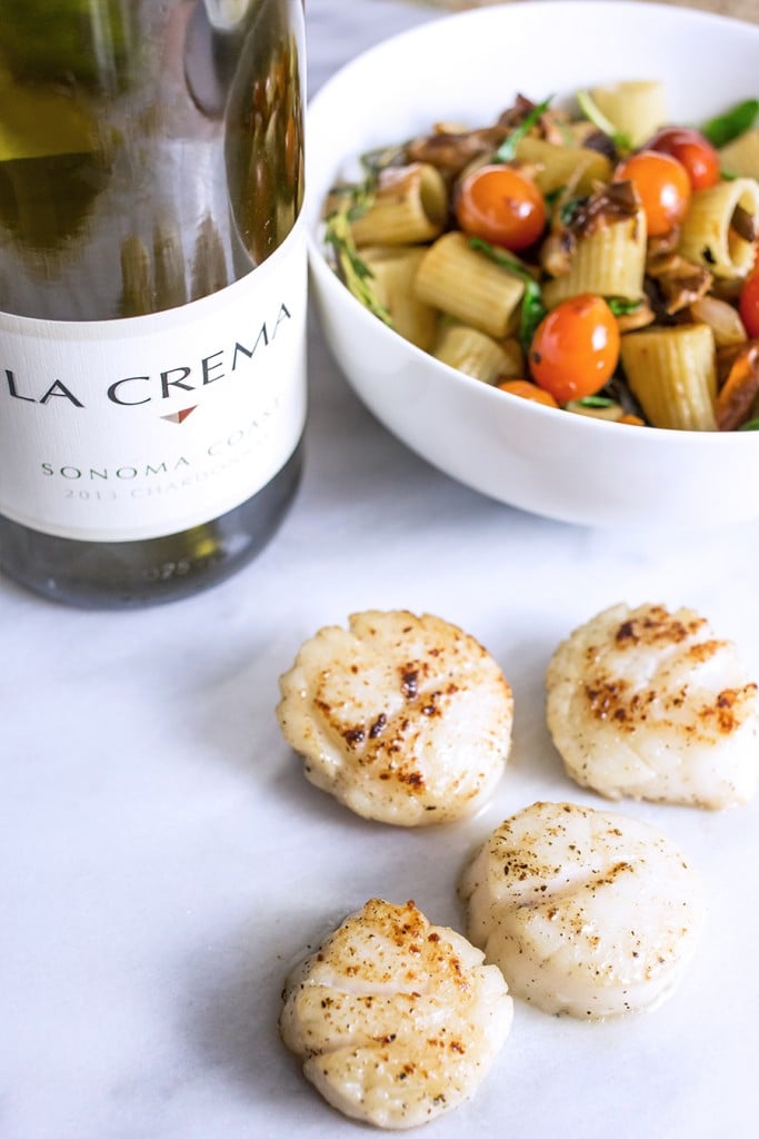 browned scallops, wine, bowl of noodles, mushrooms, tomatoes, and arugula, thyme