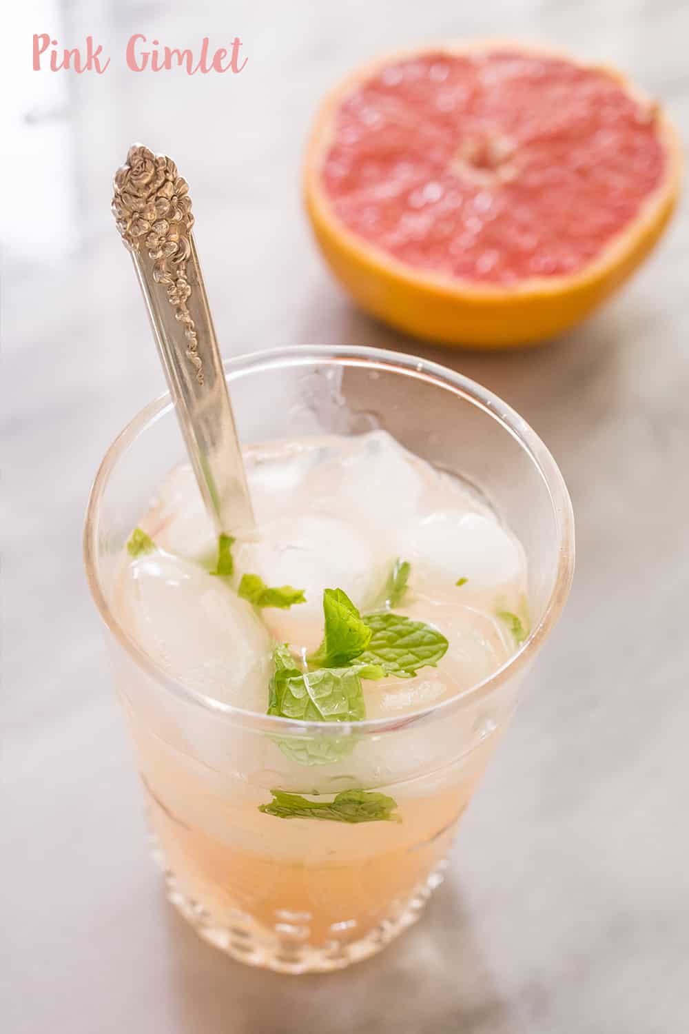 Pink Gimlet- this delicious gimlet is dressed up with a dash of grapefruit and mint for a refreshing, delicious cocktail!