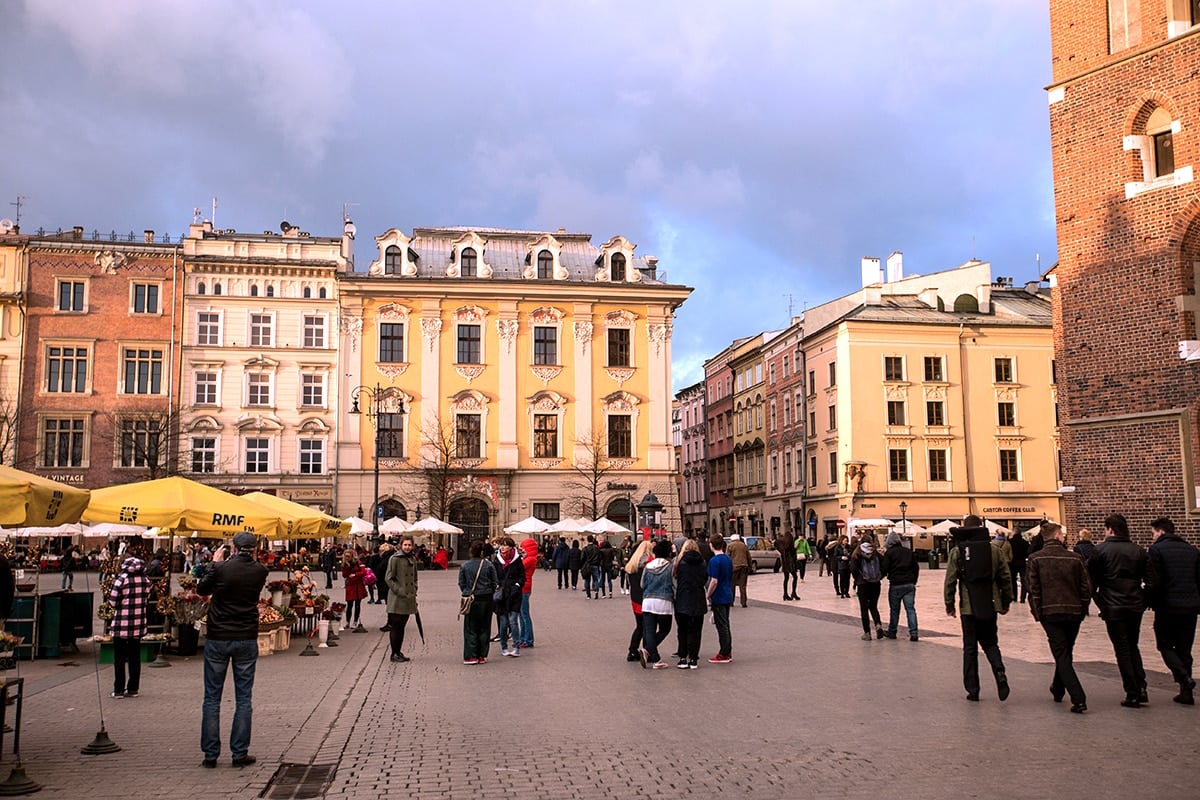 Krakow main square at sunset- love all the flower vendors and cafes!