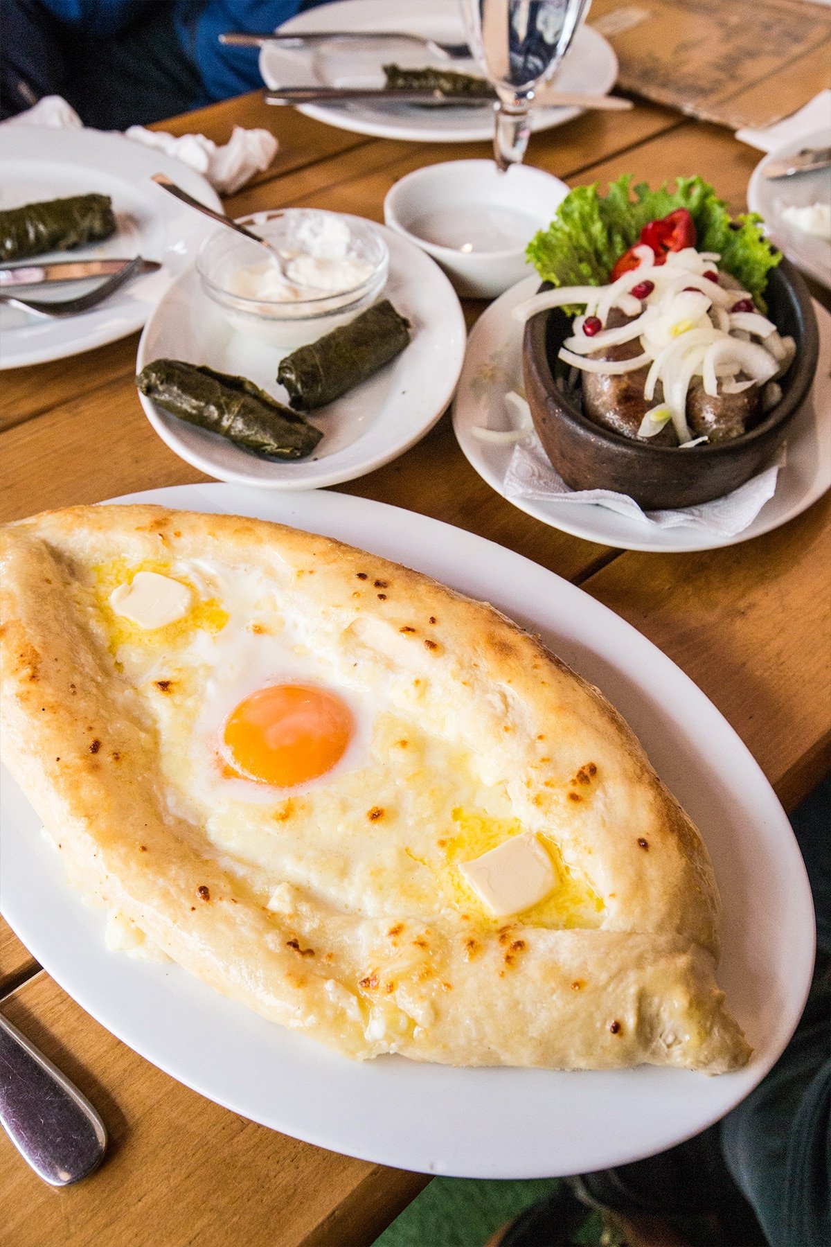 Khachapuri, sausages and dolmades at a Tbilisi cafe