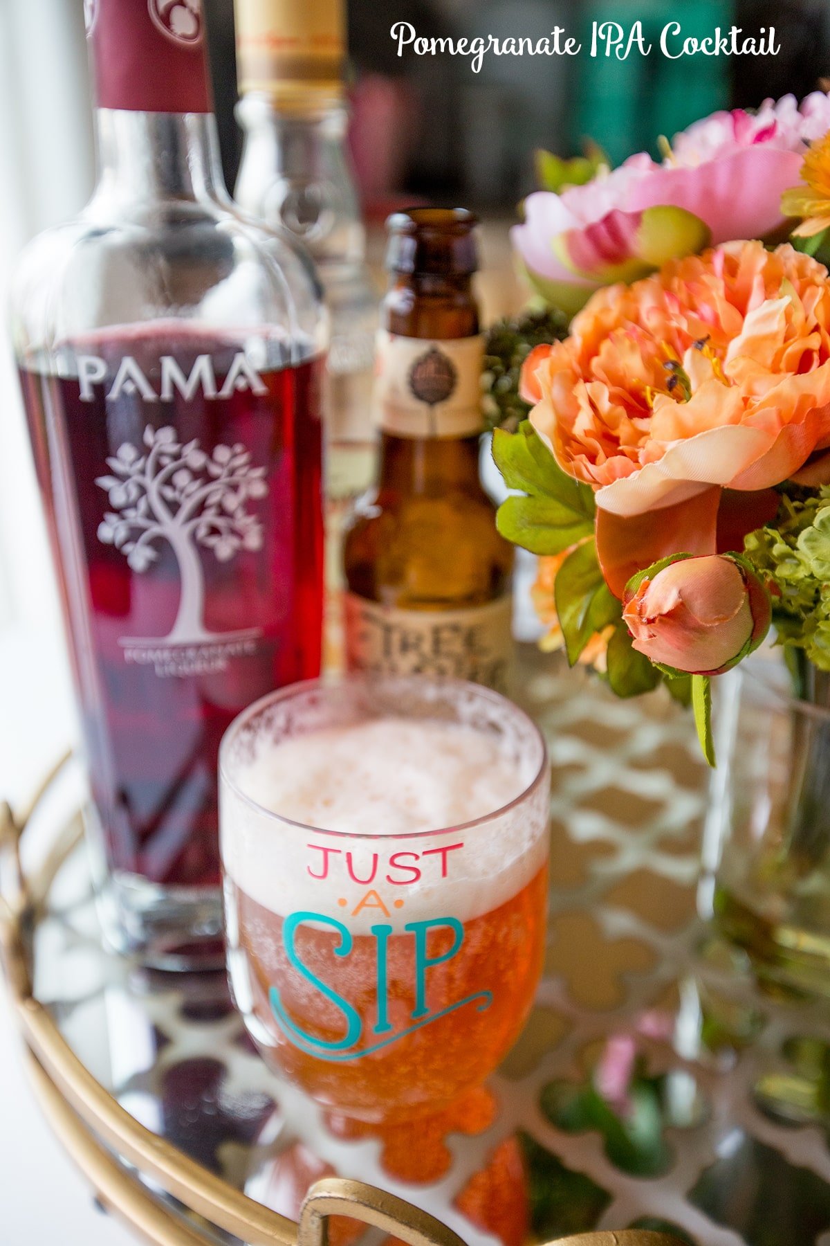 pomegranate liquor and ipa beer, mixed cocktail in a just a sip cup