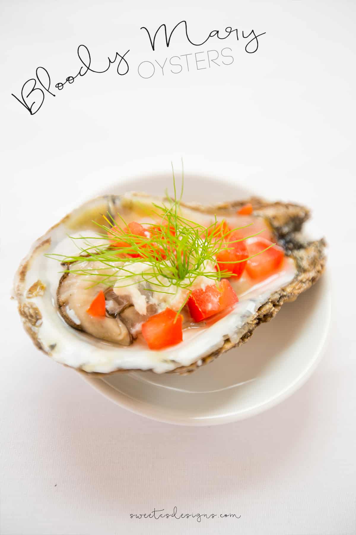 oysters with tomatoes and dill on them