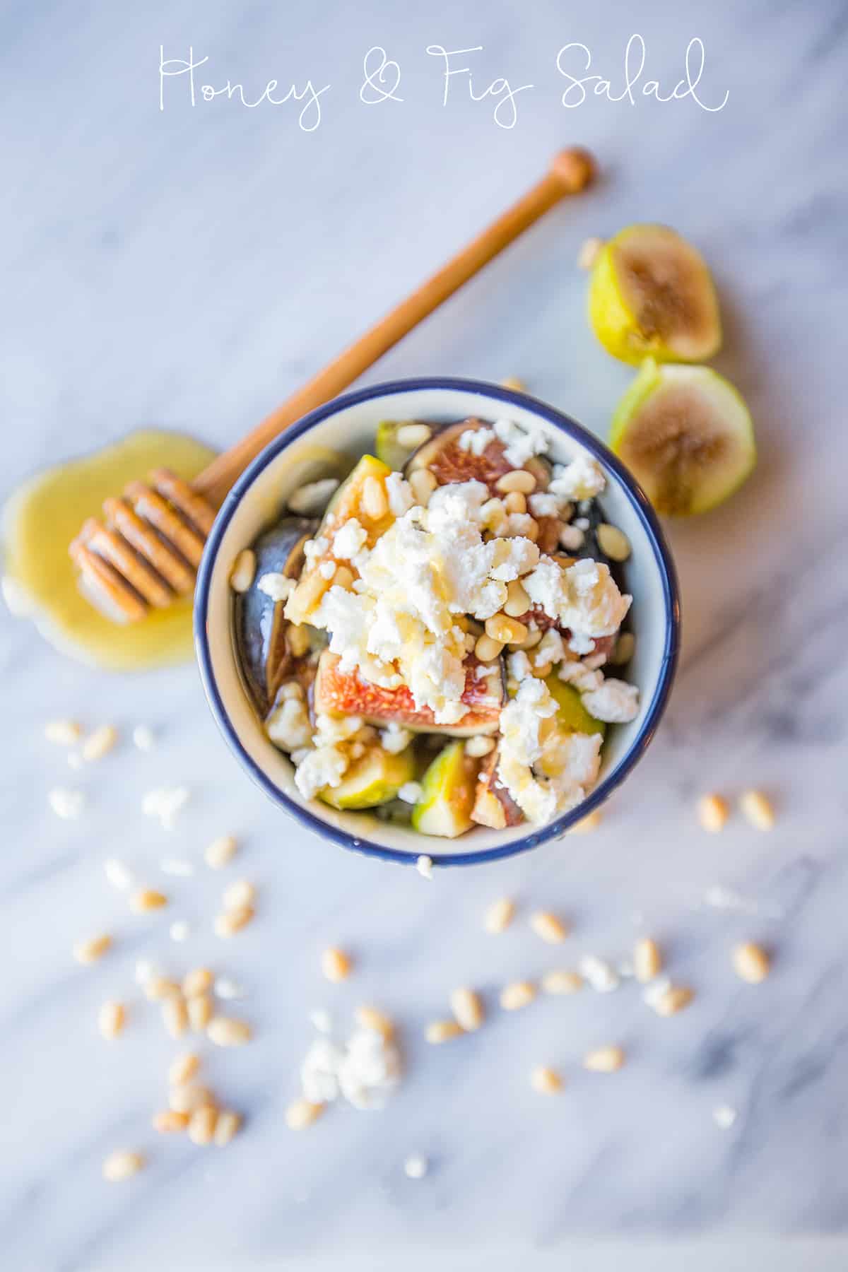 bowl with figs, crumbled cheese, and pine nuts