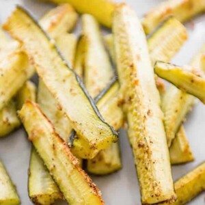 A plate of baked Parmesan garlic zucchini "fries.