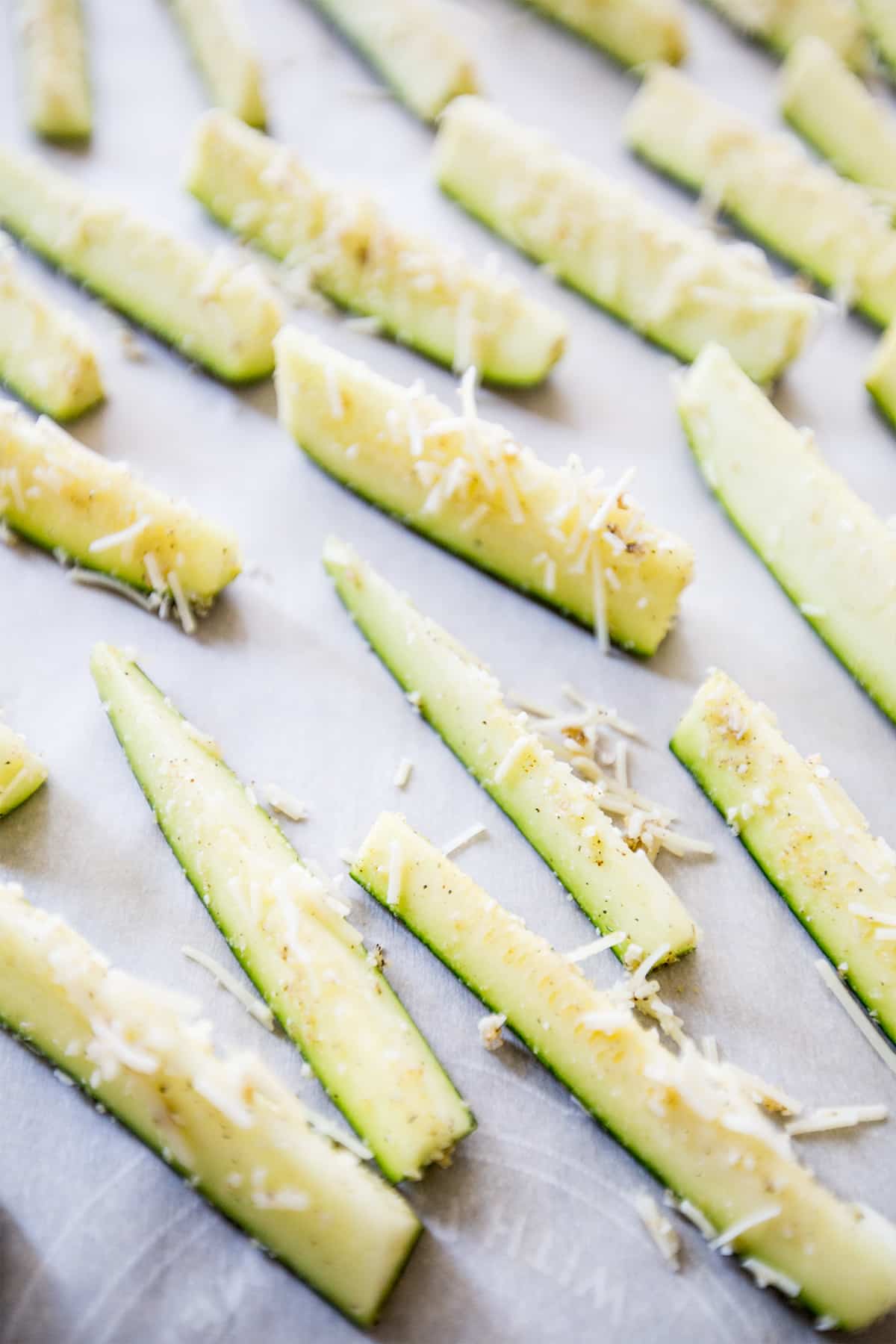 seasoned zucchini slices with cheese on them