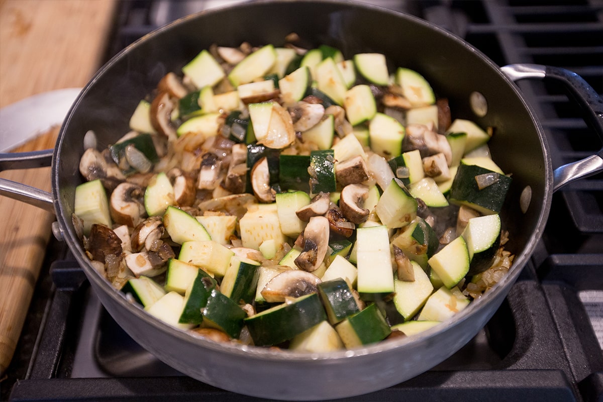 zucchini and mushroom chopped in a large pan