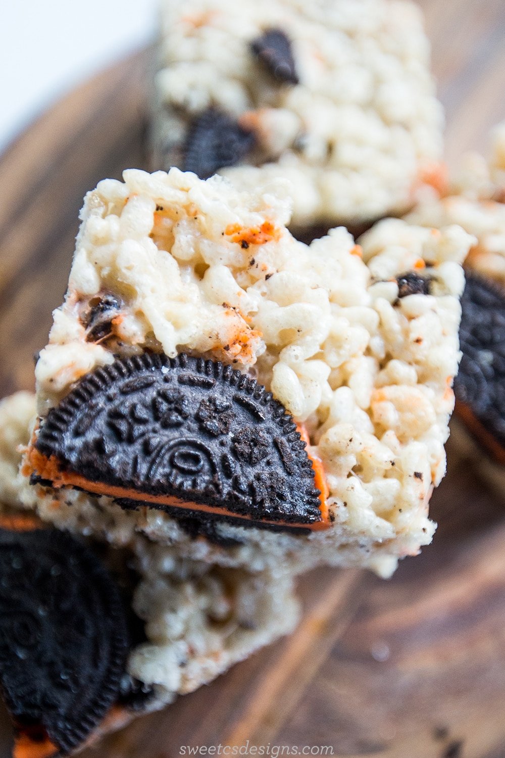 rice crispies with Halloween Oreos in them on a wooden cutting board