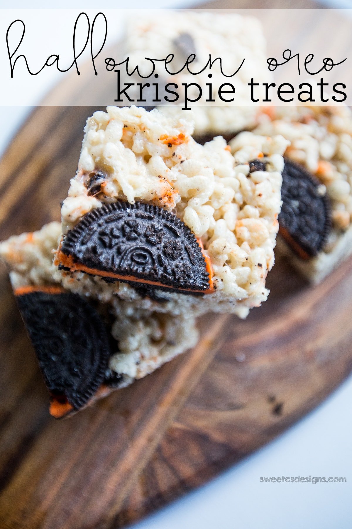 rice crispies with Halloween Oreos in them on a wooden cutting board