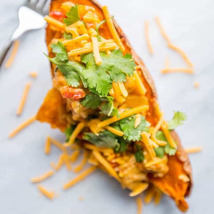 Chicken Green Chili Stuffed Sweet Potatoes: A satisfying and flavorful dish featuring tender chicken and spicy green chili nestled inside roasted sweet potatoes.