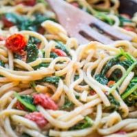 Creative one pot garden Alfredo pasta skillet with spinach and tomatoes.
