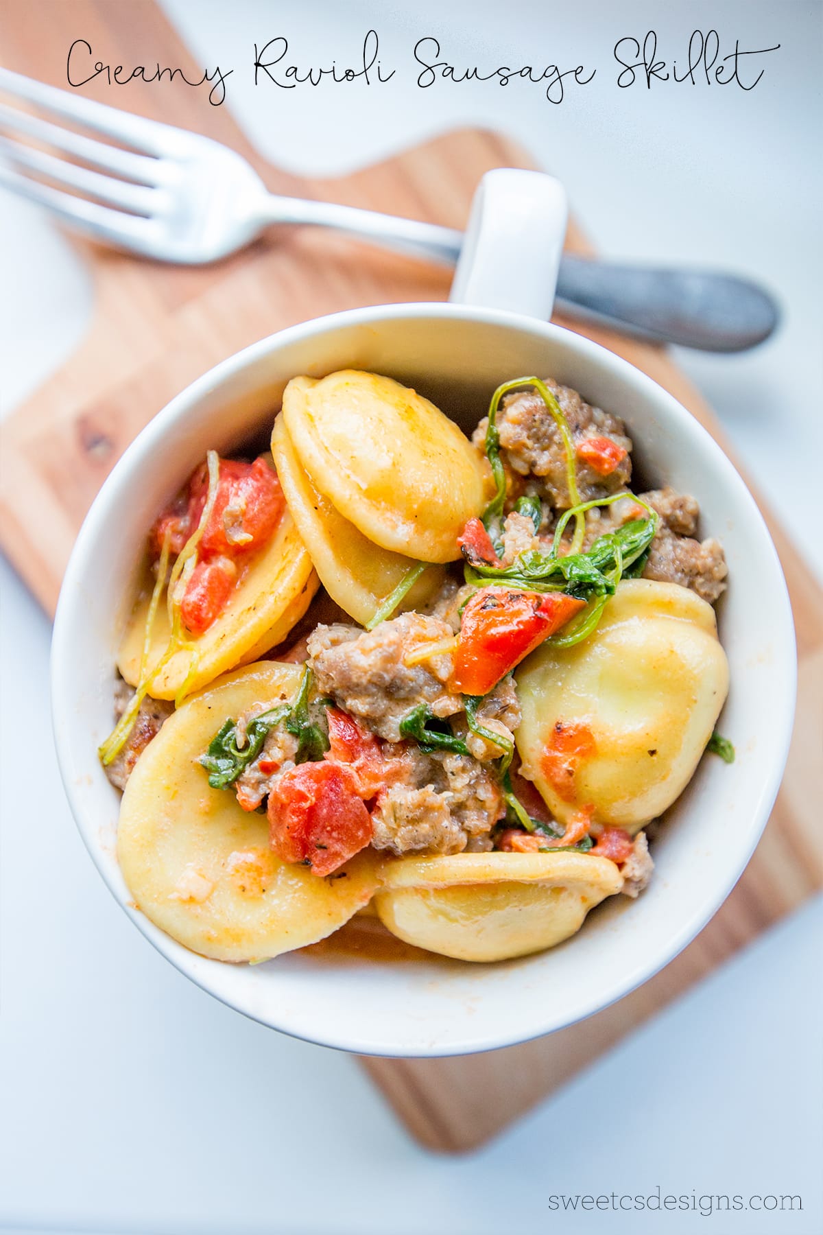 This one pot creamy ravioli and sausage skillet with arugula is so good!