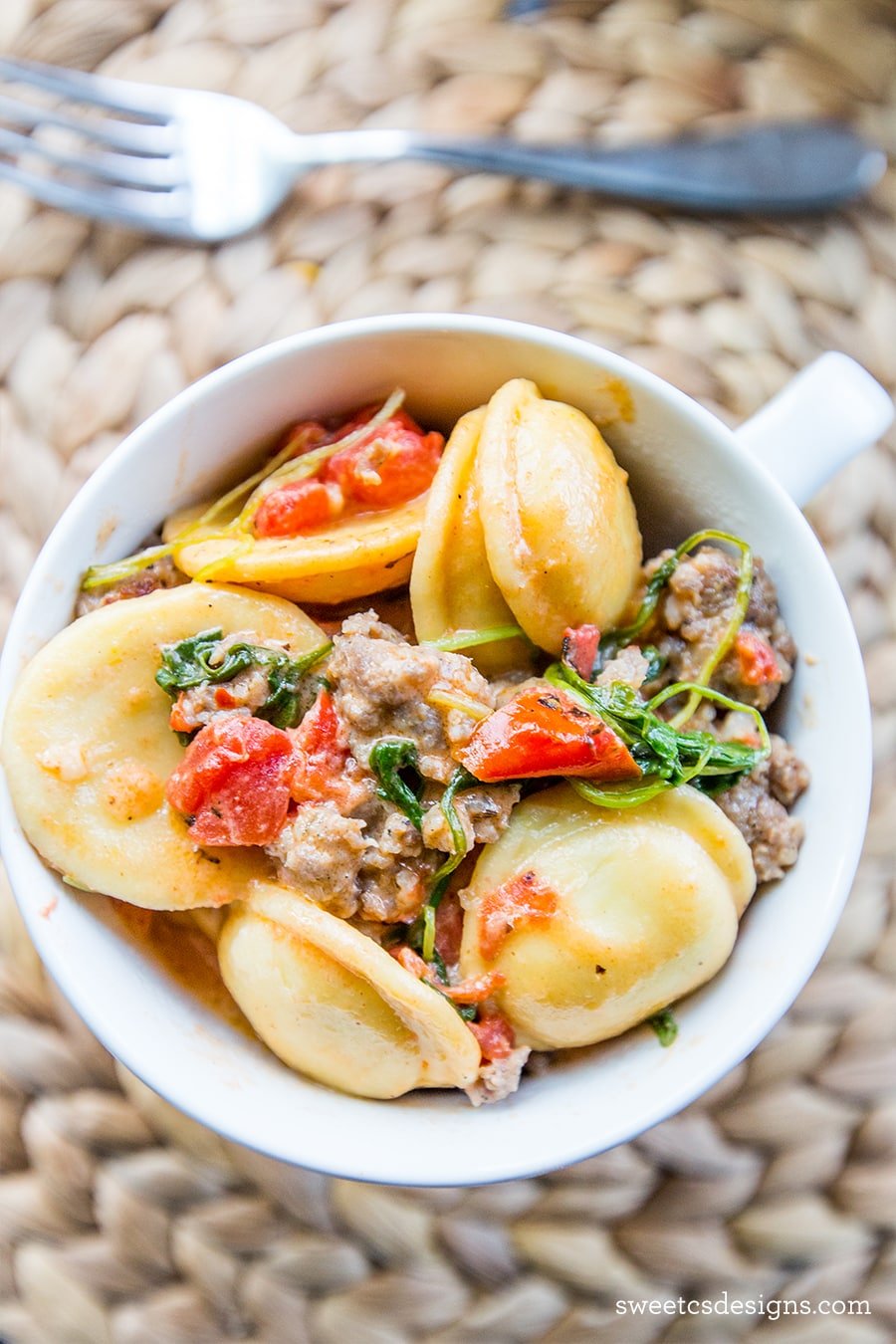 This skillet sausage and ravioli dish is so creamy and delicious- YUM!