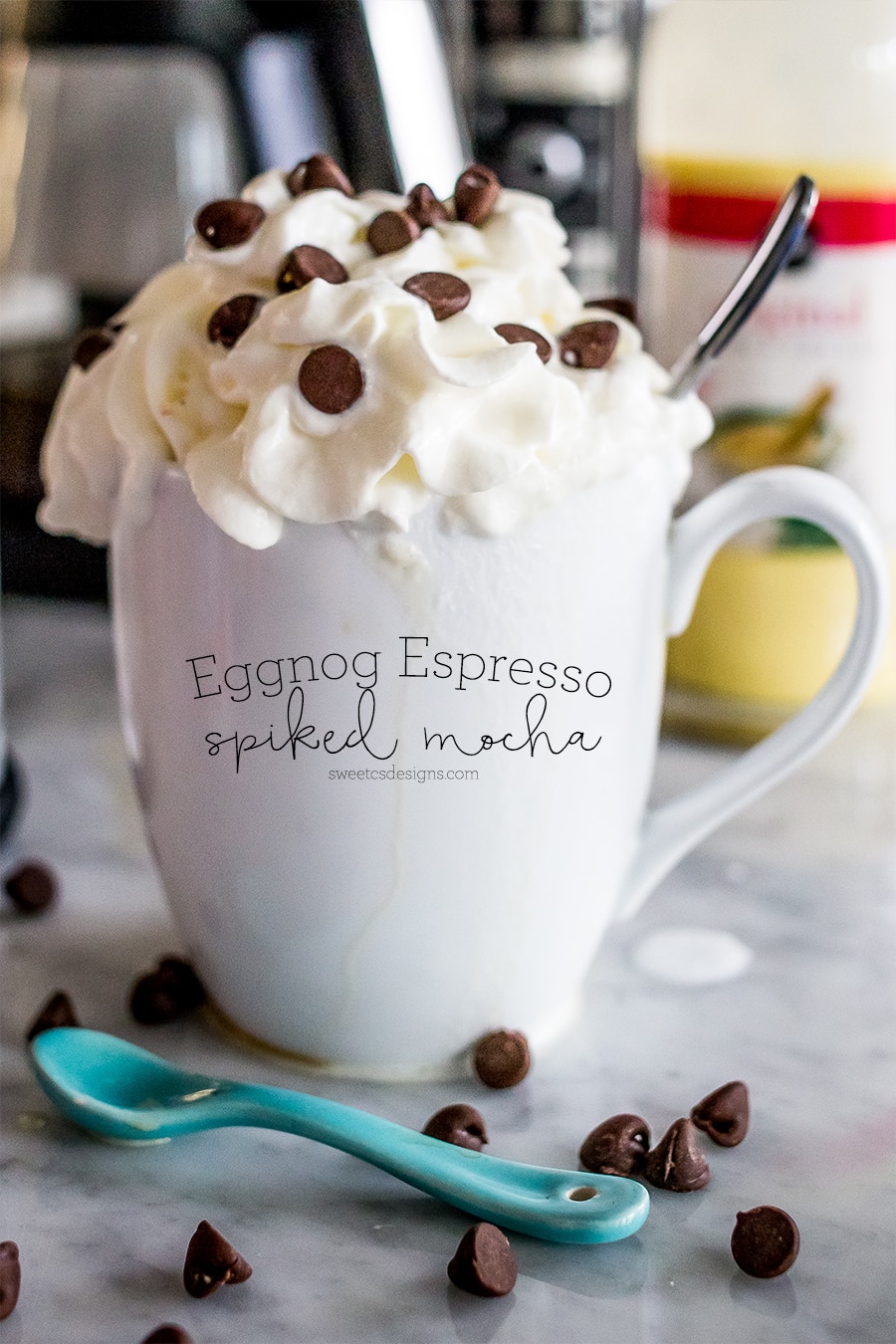 drink in a white mug with whipped cream and chocolate chips