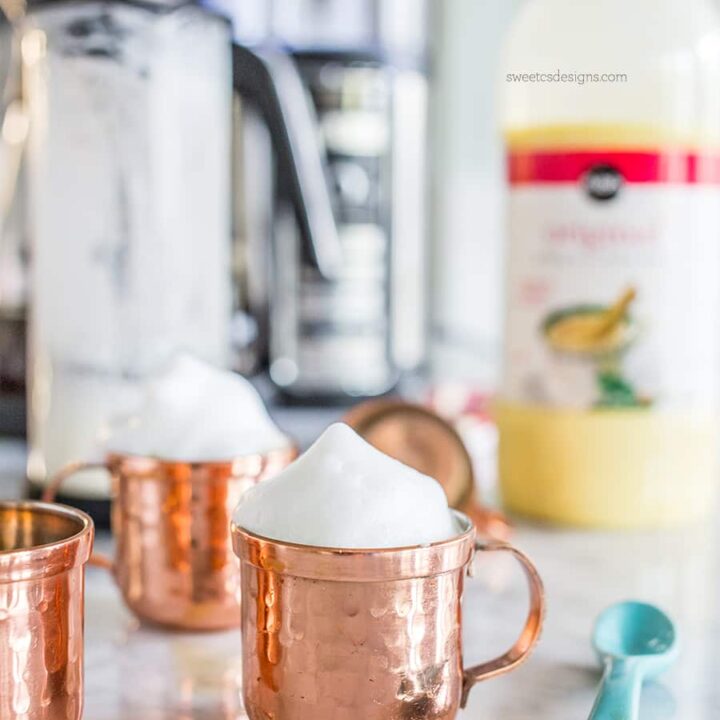 picture of copper shooter mug with foam on the countertop