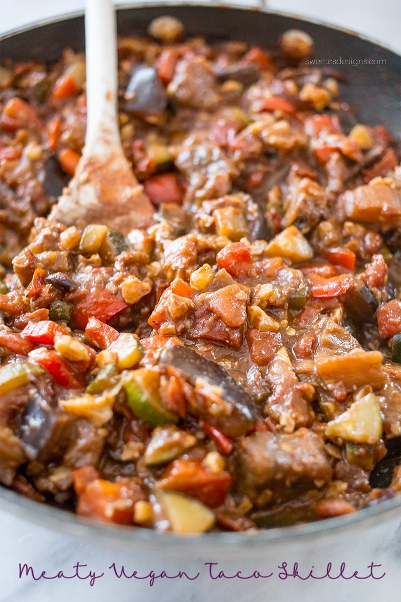 skillet with sauteed vegetables, eggplant, zucchini, tomato, and chickpeas