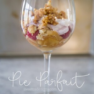 Leftover pie parfait served in a glass container with a spoon.