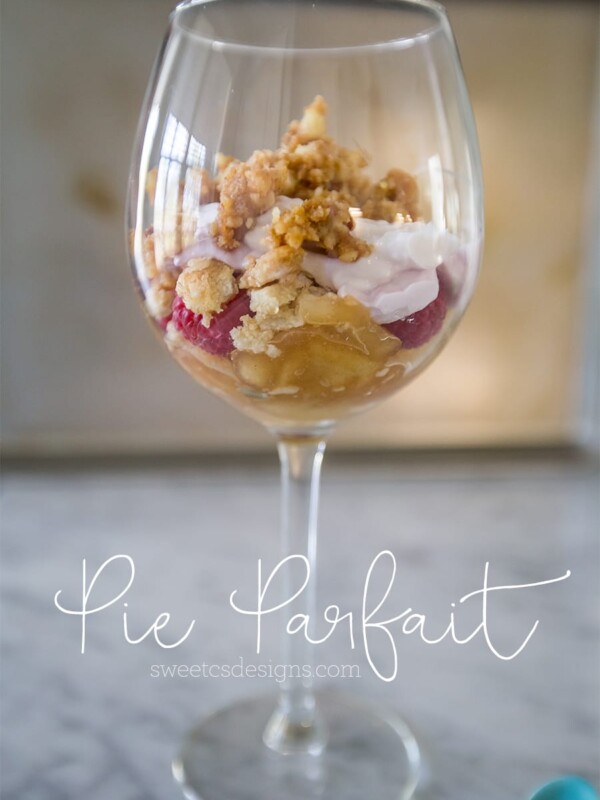 Leftover pie parfait served in a glass container with a spoon.