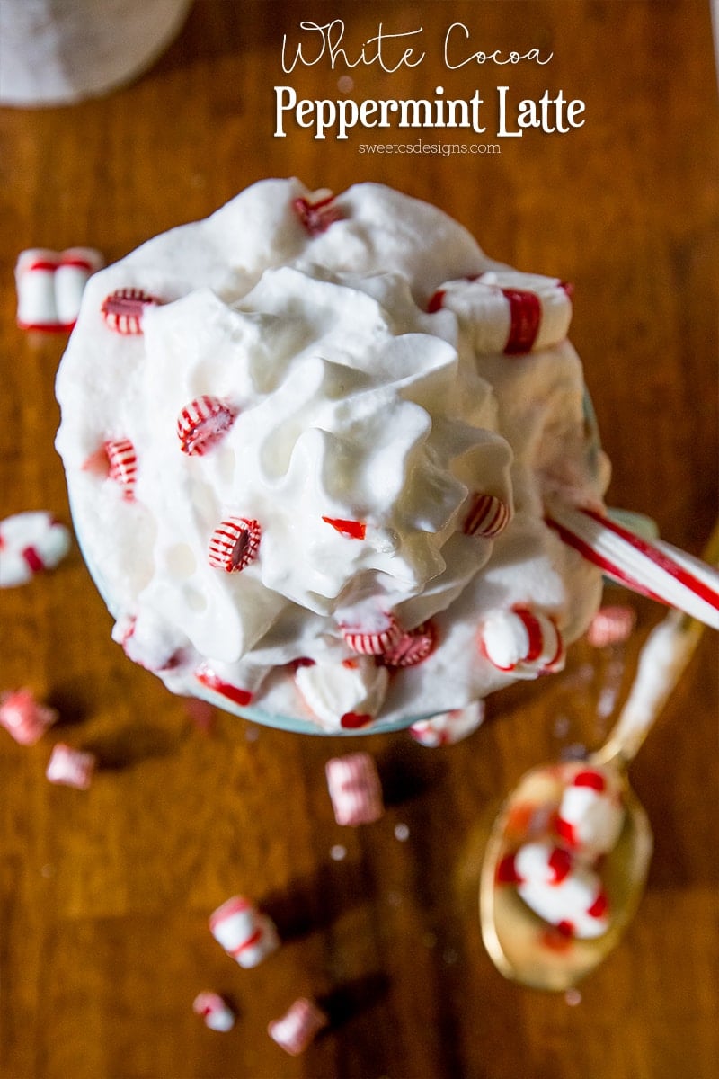 mug with whipped cream and mints coming out the top