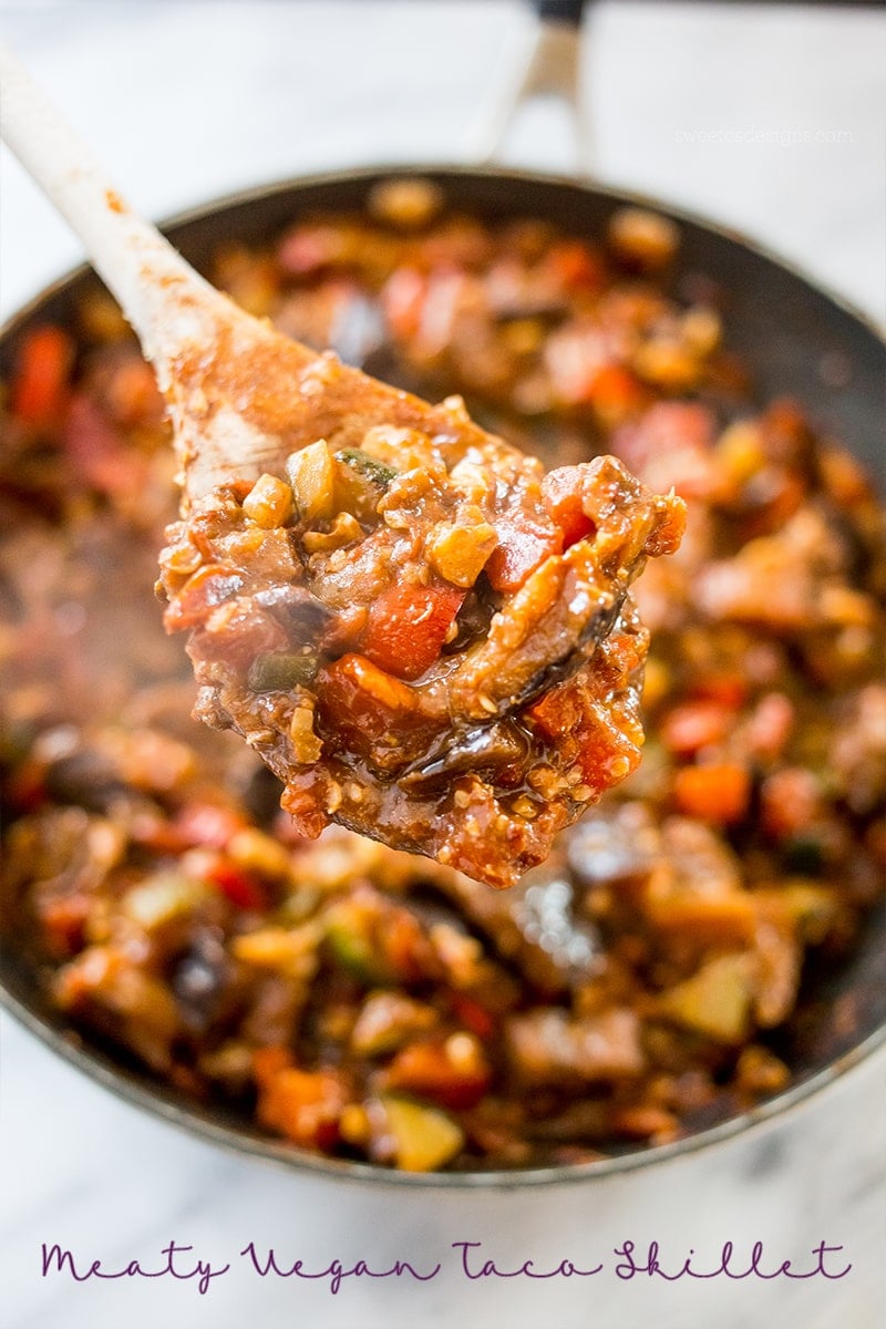 skillet with sauteed vegetables, eggplant, zucchini, tomato, and chickpeas