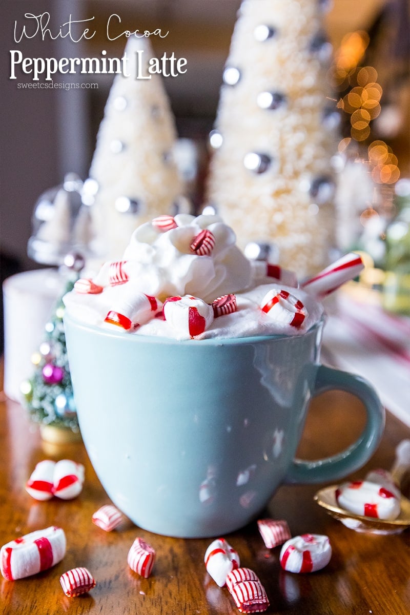 mug with whipped cream and mints coming out the top