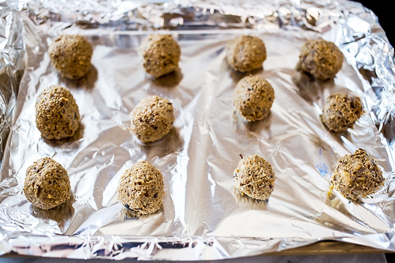 paleo meatballs laid out on tin foil.