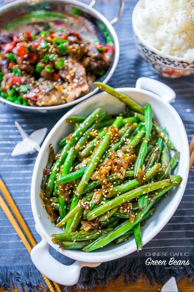 picture of chinese garlic green beans in a white bowl on a table