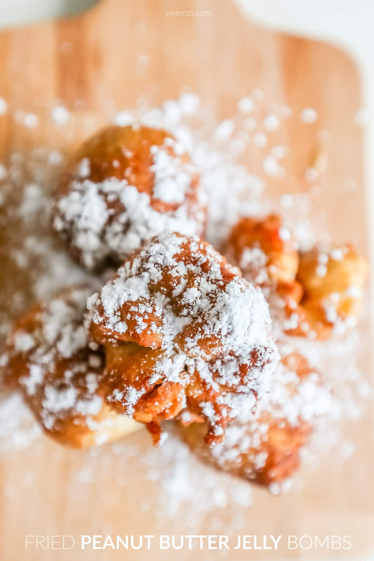 fried dough with powdered sugar on them