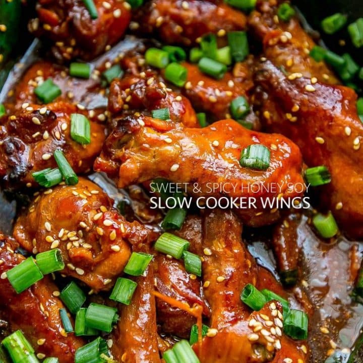 Slow cooker chicken wings with green onions and sesame seeds.
