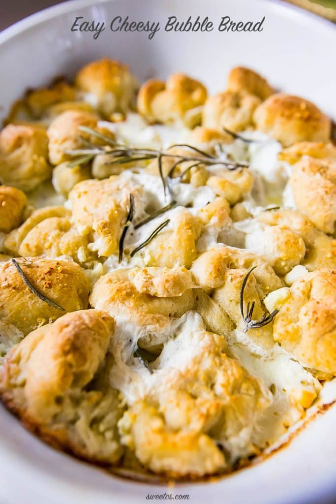 bread in a casserole dish with cheese and rosemary