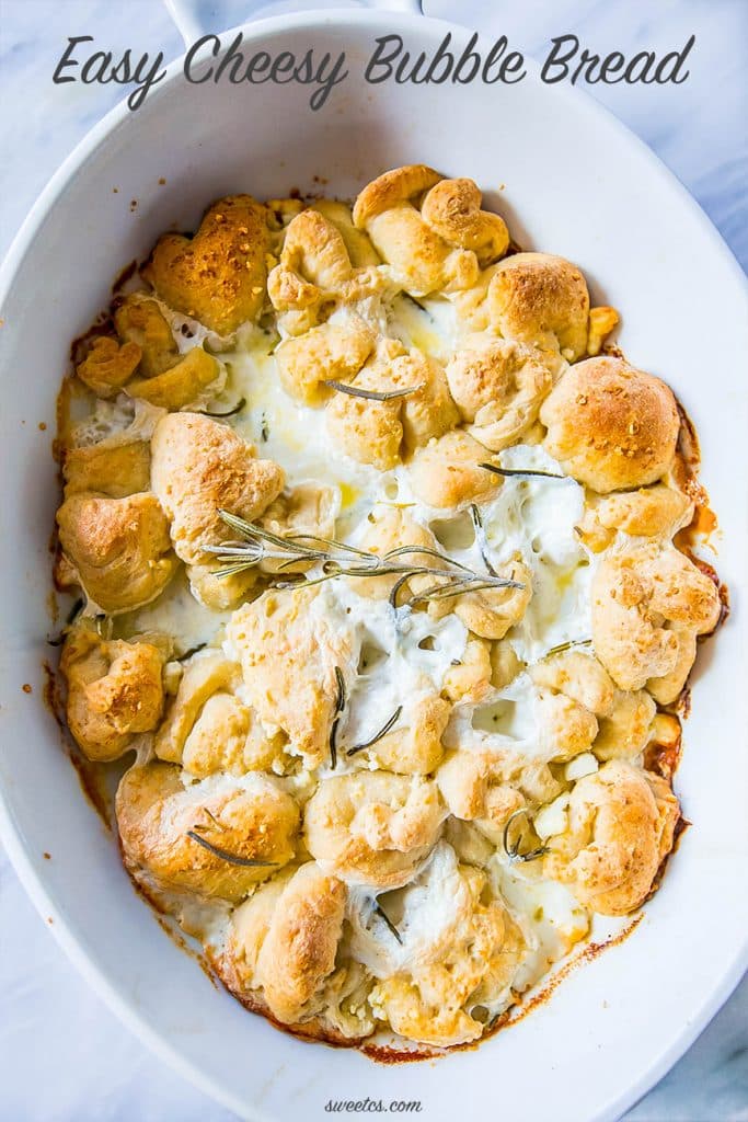 bread in a casserole dish with cheese and rosemary