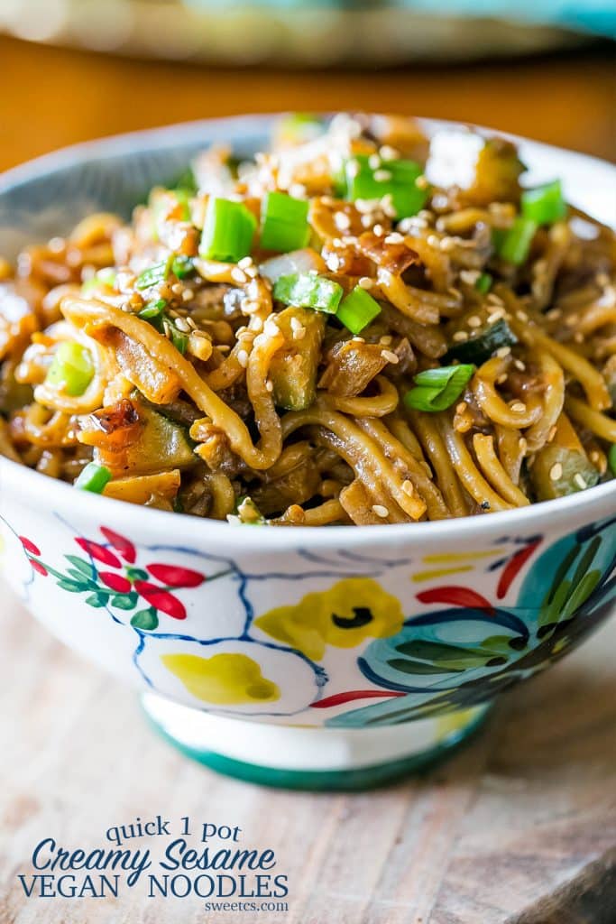 flower bowl with tahini noodles piled high inside