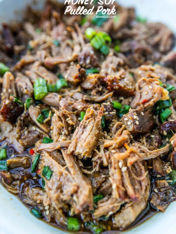 Honey soy pulled pork in a white bowl.