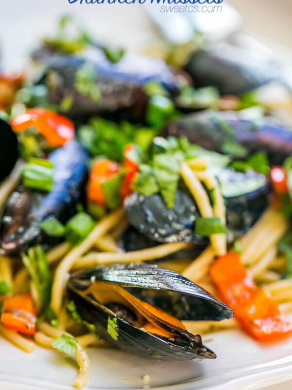 A 15-minute pasta dish featuring drunken mussels on a white plate.