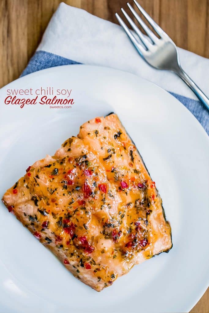 chili glazed salmon on a white plate with fork